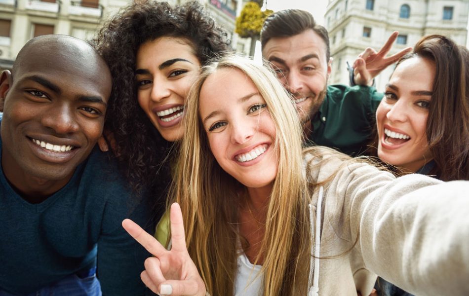 multiracial-group-young-people-taking-selfie